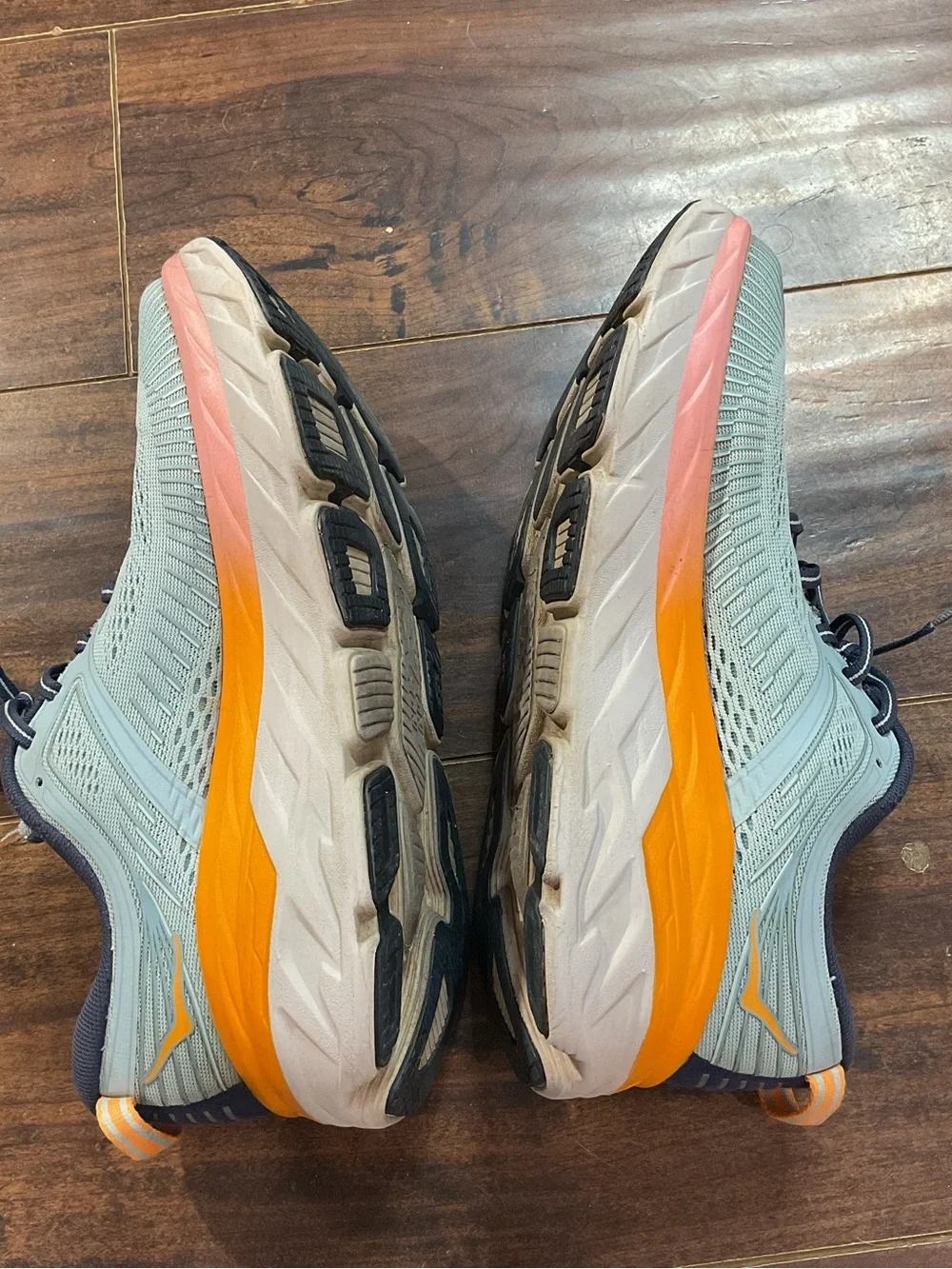Hoka Blue Athletic Shoes with Orange and Pink Accents